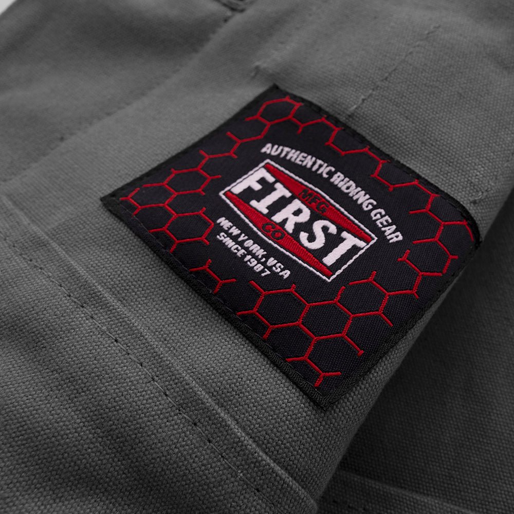 Motorcycle club style, leather and grey canvas vest